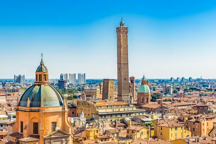 Panoramic view of Bologna's historic towers and domes, showcasing the city's rich architectural heritage.