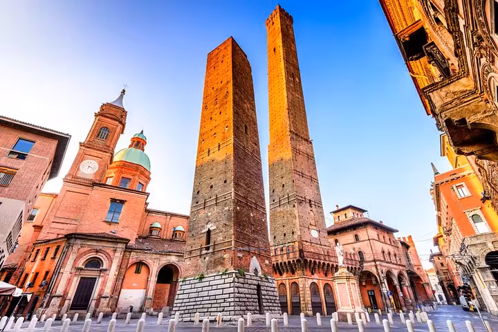 Close-up of Bologna's iconic leaning towers, a must-see landmark on the Ferrari Museum Maranello tour.