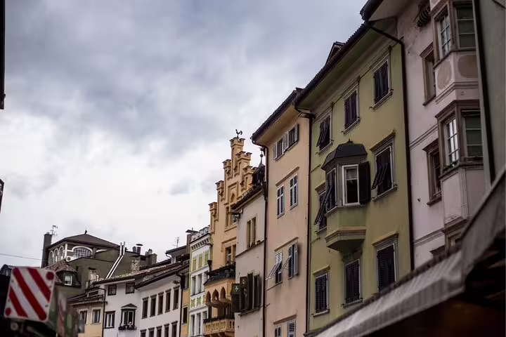 Historic Bolzano old town facades and balconies on a walking route for the Bolzano self-guided scavenger hunt