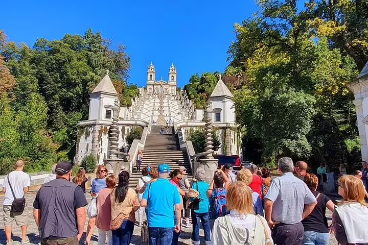 Tourists gather at the iconic Bom Jesus do Monte staircase in Braga on the Minho Tour Private full-day experience.