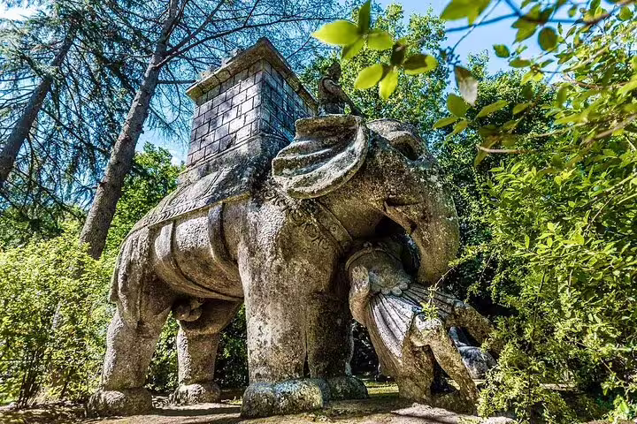 Ancient stone elephant statue in Bomarzo Monster Park, a highlight of the Rome Calcata Bomarzo Pope Thermal Bath tour