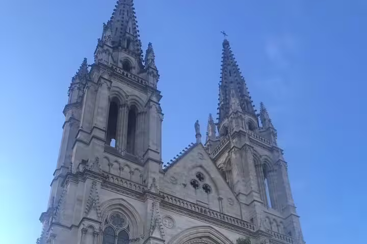 Gothic cathedral spires in Bordeaux on the wine history walking tour before wine and cheese tasting