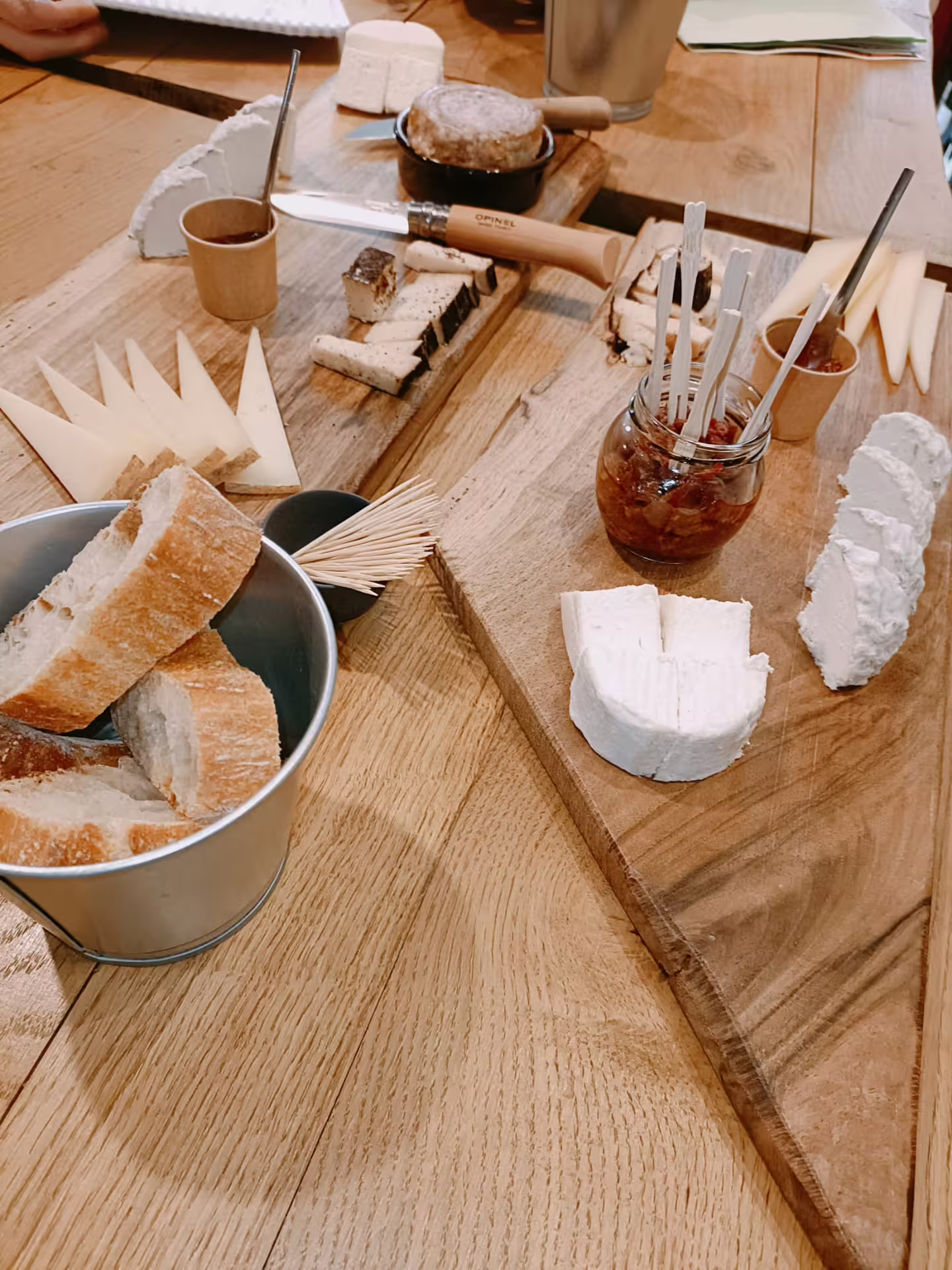 Cheese board with artisan cheeses, bread and chutney paired for blind tasting organic Bordeaux wines and charcuterie
