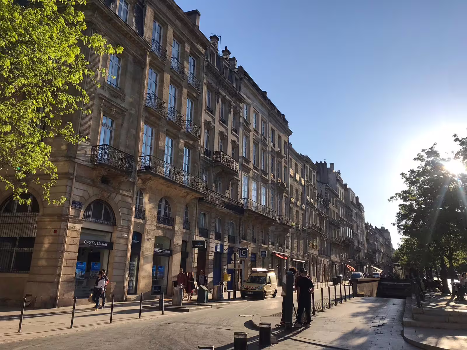 Historic Bordeaux streetscape on a private walking tour, exploring elegant stone façades before natural wine tasting