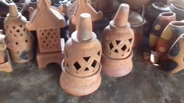 Terracotta lanterns and handmade pottery souvenirs at local workshop stop on Borobudur VW Safari Tour route