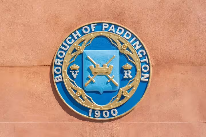 Borough of Paddington official coat of arms seal dated 1900 mounted on a terracotta wall