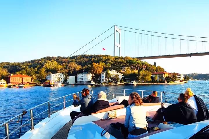 Bosphorus cruise by Istanbul city break tour, sailing past the Bosphorus Bridge with waterfront mansions