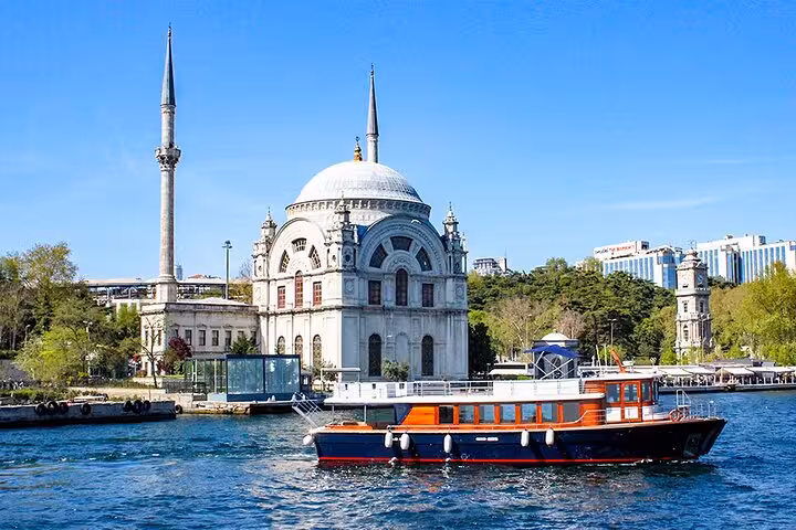 Bosphorus sightseeing boat in front of Ortakoy Mosque, Istanbul Asia-Europe tour with museum fees and lunch