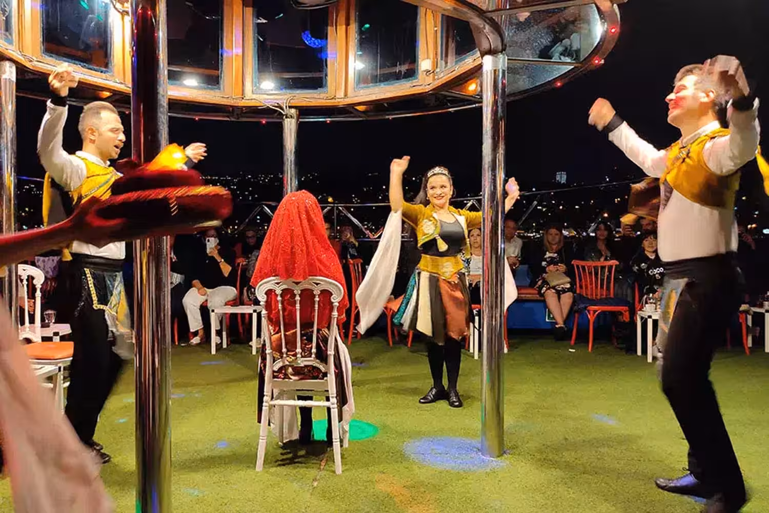Traditional Turkish folk dance show on Bosphorus dinner cruise Istanbul, live entertainment on open deck at night