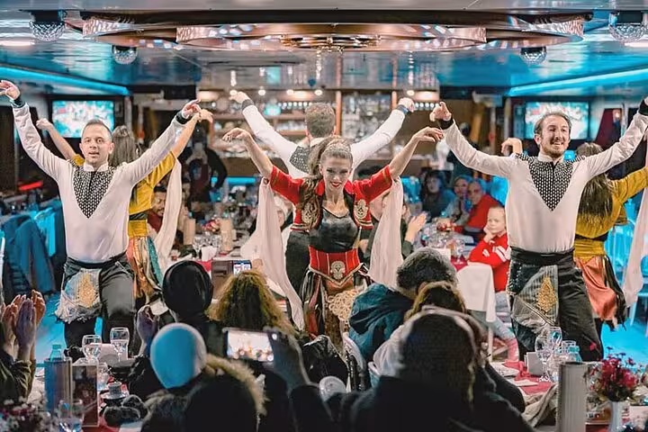 Turkish folk dance show on Bosphorus dinner cruise, guests seated at private tables enjoying live entertainment