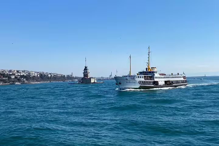 Ferry on the Bosphorus with Maiden’s Tower, Istanbul highlight on 13-day Turkey history private guided tour