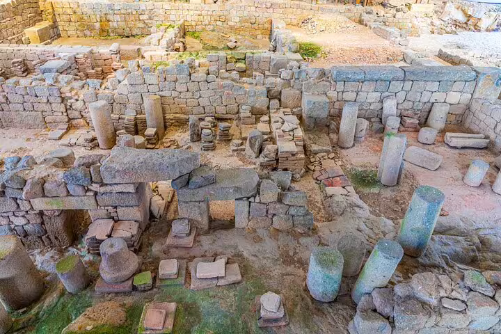 Ancient Roman ruins with stone columns and walls at archaeological site in Braga, Portugal