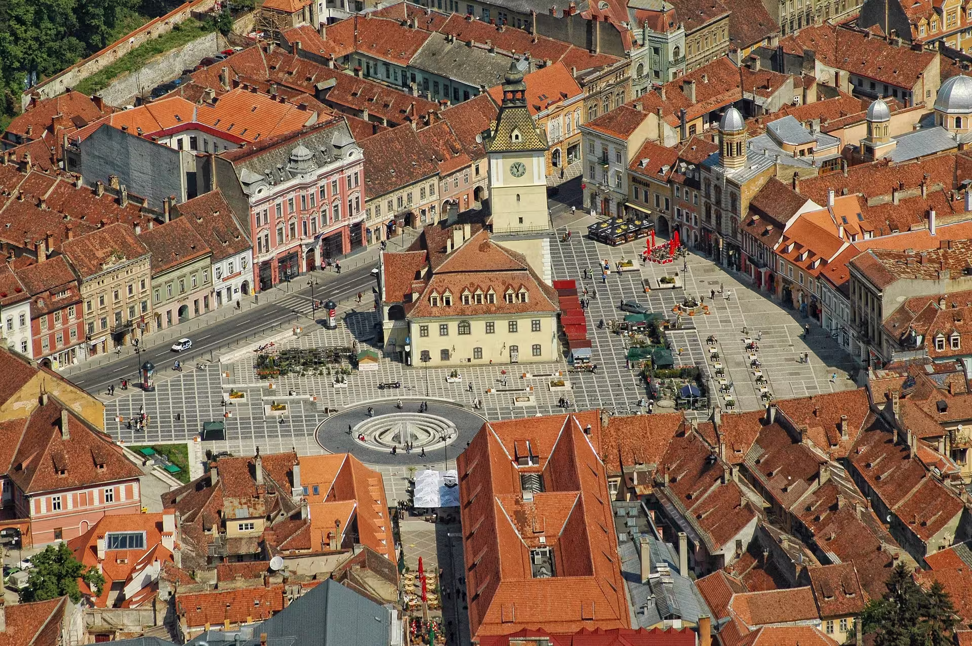 Aerial view of Brasov's medieval town square, highlighting historic architecture and vibrant cobblestone streets.