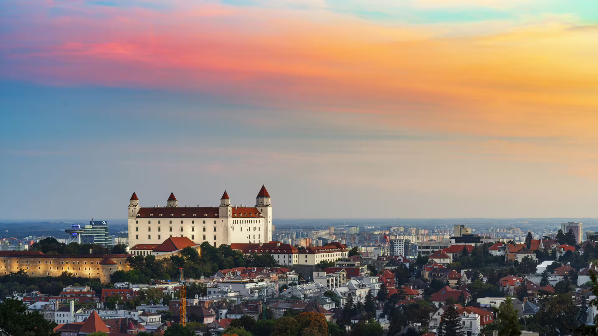 Panoramic view of Bratislava Castle at sunset, key stop on 1-day walking tour with multilingual audioguide