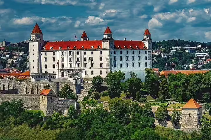 Scenic view of Bratislava Castle on a sunny day, ideal for a private day trip from Vienna exploring Slovakia's rich history.