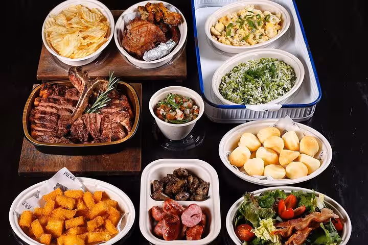An array of traditional Brazilian BBQ dishes and sides served at a guided dinner in Rio.