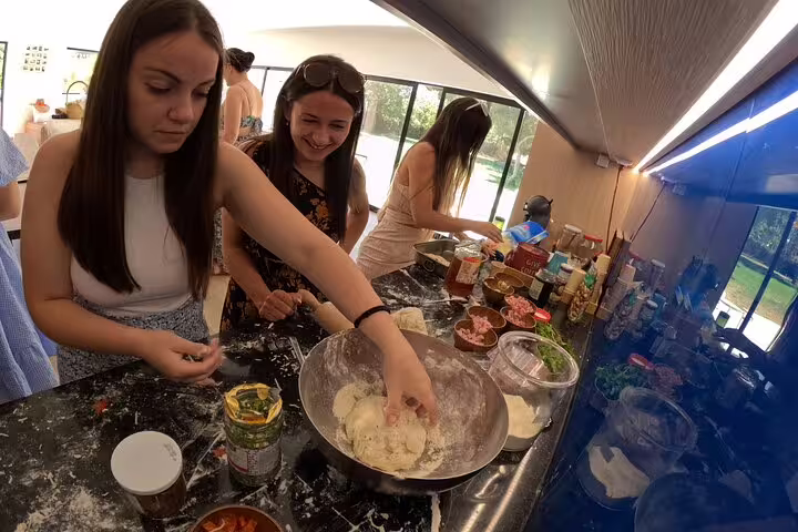 Participants enjoy a hands-on culinary experience making dough at Bread, Wine & Cheese, The Natural Taste workshop.