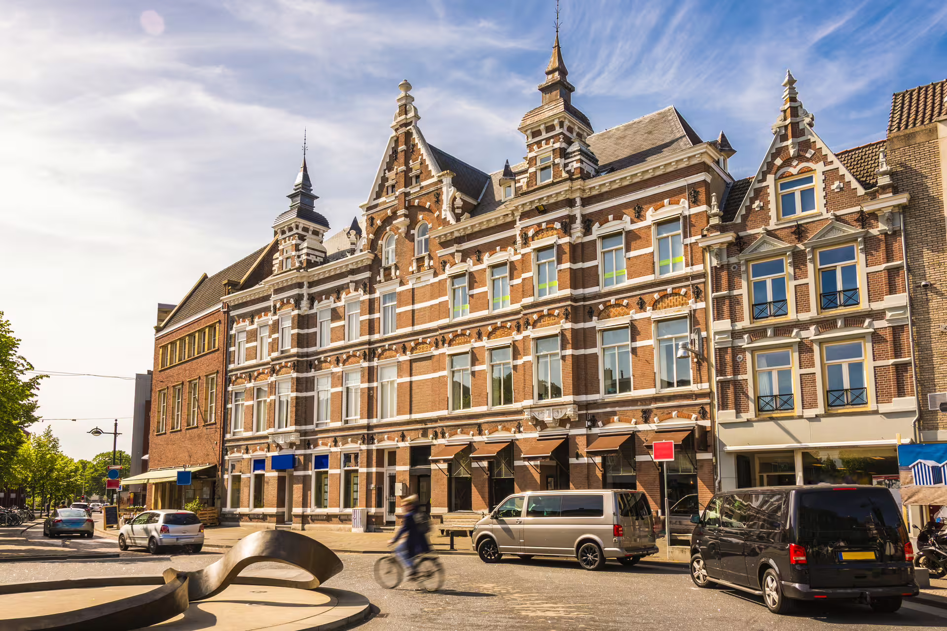 Historic Breda city center street with ornate Dutch gabled building, featured on 1-day walking audioguide tour