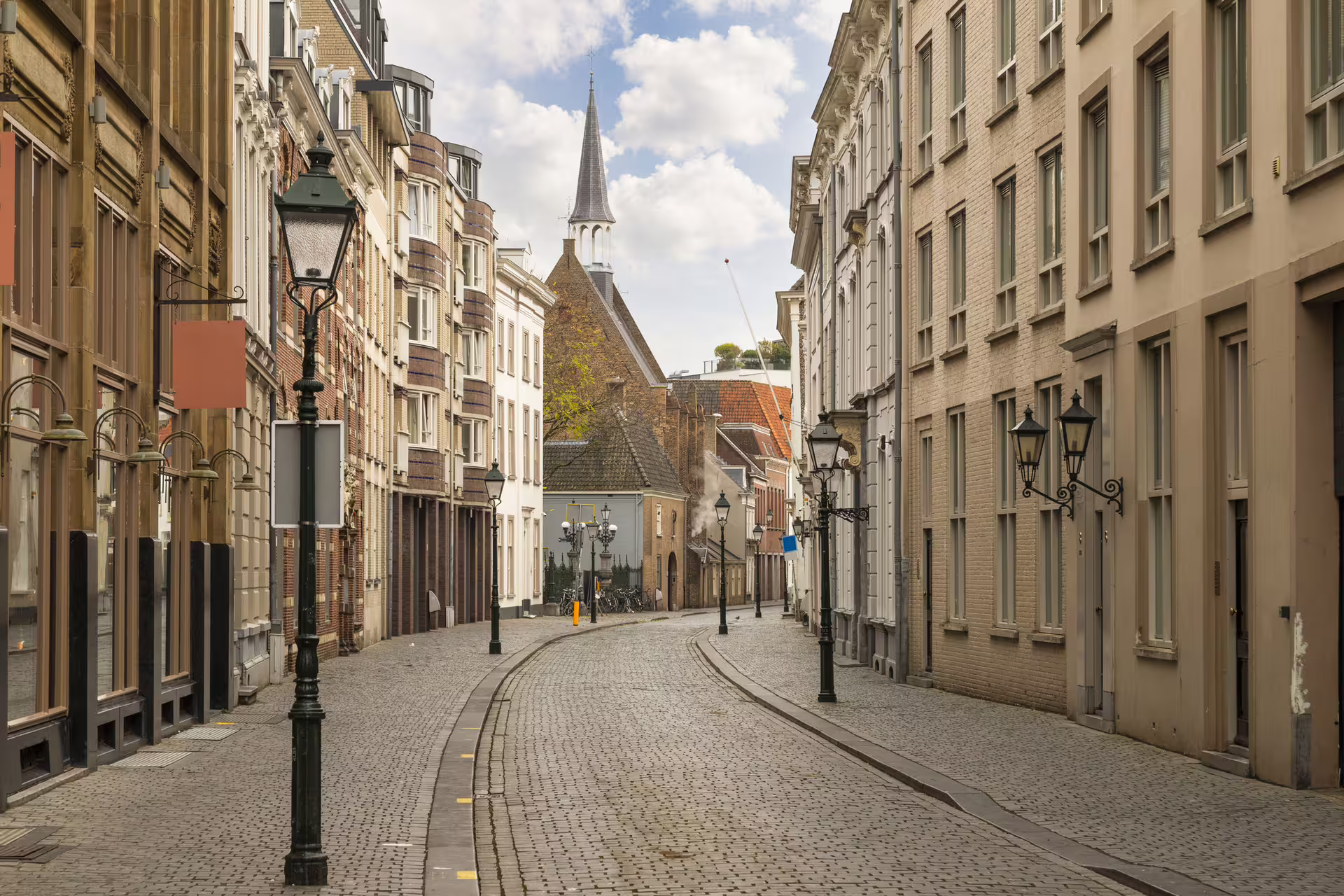 Quiet cobblestone street in historic Breda, Netherlands, featured on 1-day walking tour with audioguide
