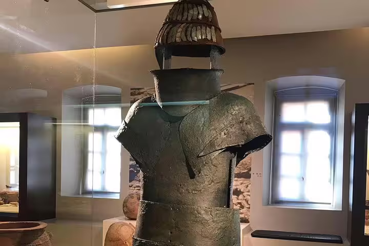 Bronze armor display at Mycenae Archaeological Museum, highlight of Epidaurus Mycenae Nafplio day tour