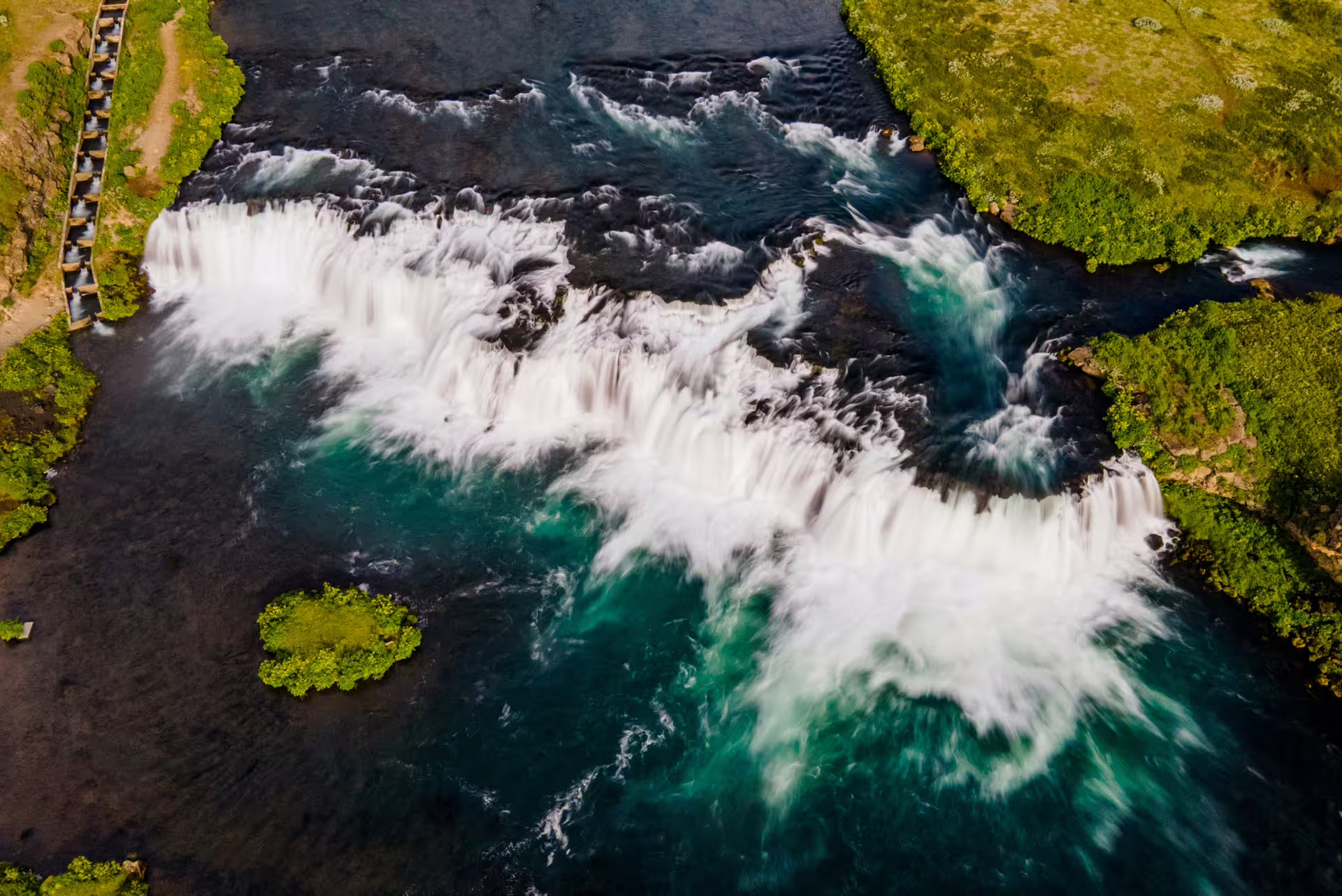 Aerial view of Brúarfoss rapids and emerald river, highlight of a Private Golden Circle Extended Tour in Iceland