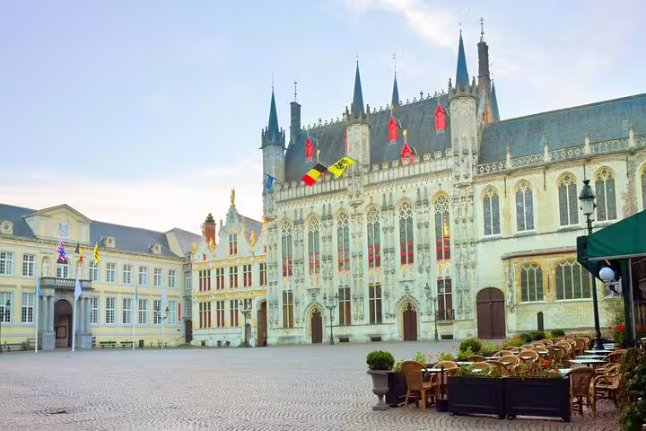 Burg Square in Bruges with Gothic City Hall and outdoor café seating on a quiet morning