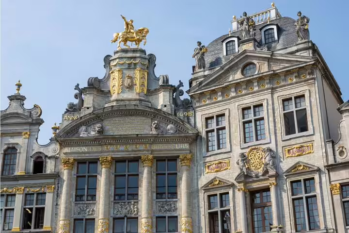 Ornate baroque guild houses with gold statues on Brussels Grand Place, Anno 1698
