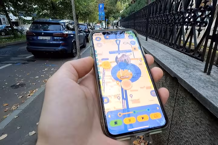 Explorer navigating Bucharest streets with a self-guided walking tour app highlighting 1989 Revolution historic landmarks