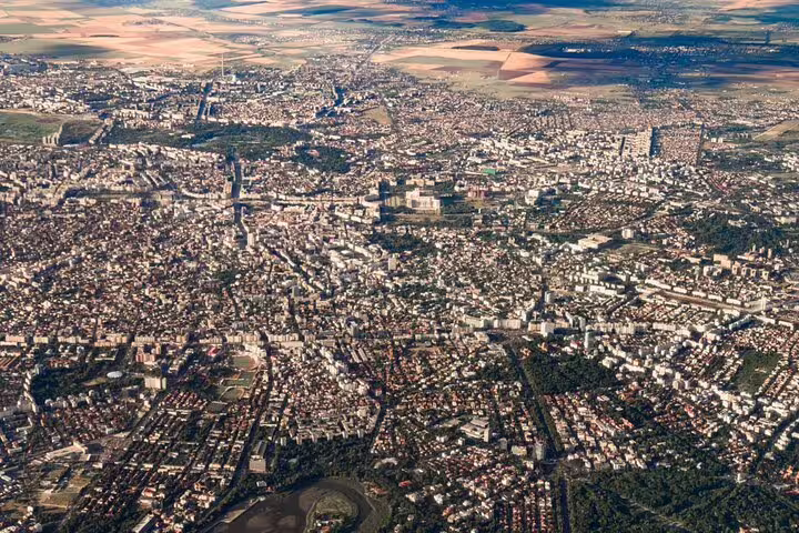 Aerial view of Bucharest city streets and buildings spreading across urban landscape