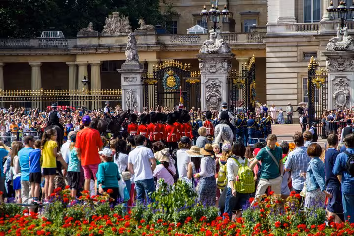 Crowds gather at Buckingham Palace gates to watch the iconic Changing of the Guard ceremony in London