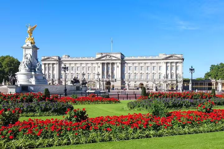 Buckingham Palace with red flower gardens and Queen Victoria Memorial, Westminster London