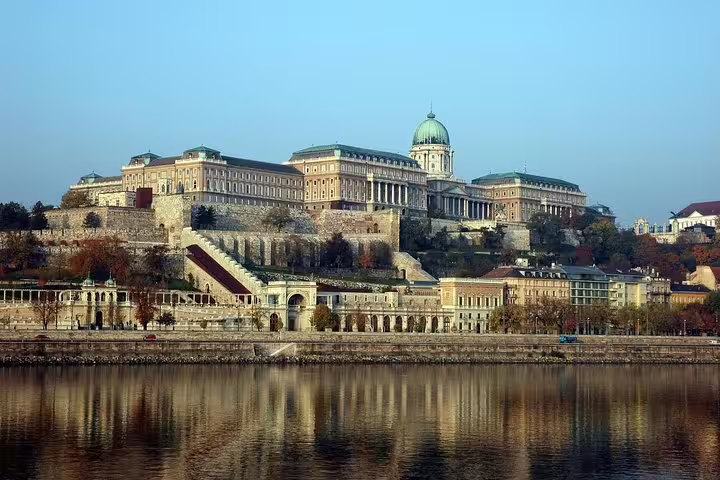 View of Buda Castle in Budapest, a highlight of the private day trip from Vienna, showcasing historical architecture by the Danube.
