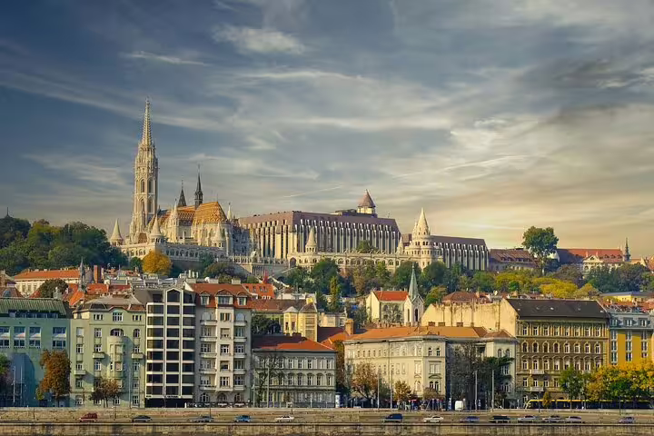 Buda Castle District skyline with Matthias Church at sunset on a Budapest private tour of hidden treasures
