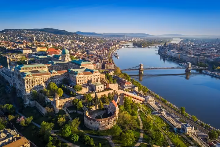 Aerial view of Buda Castle and Chain Bridge along the Danube River in Budapest, Hungary