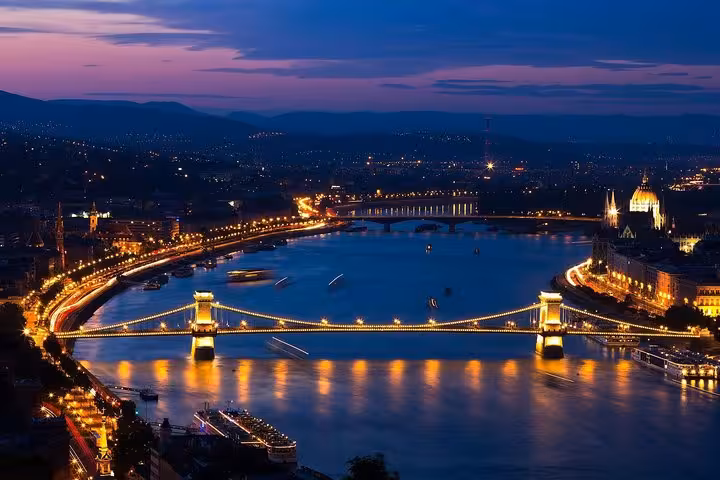 Budapest night skyline on Danube with Chain Bridge and Parliament, highlight of private day trip from Vienna