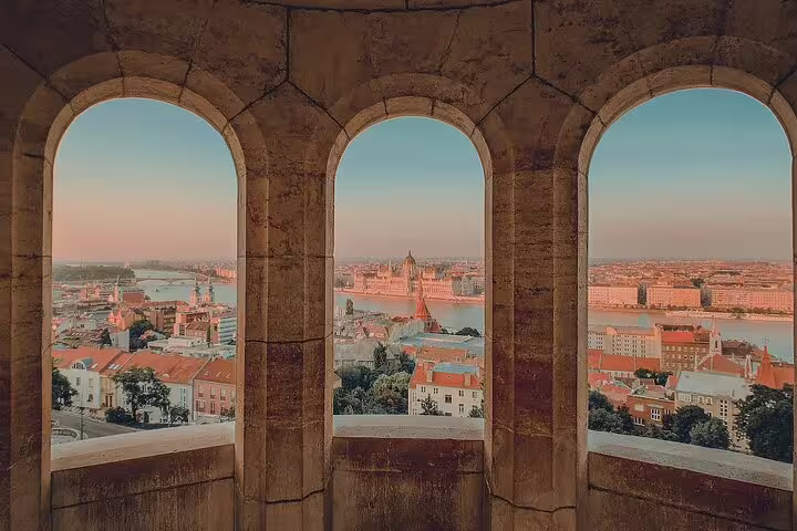 Panoramic view of Budapest cityscape and Parliament building from Fisherman's Bastion arched windows