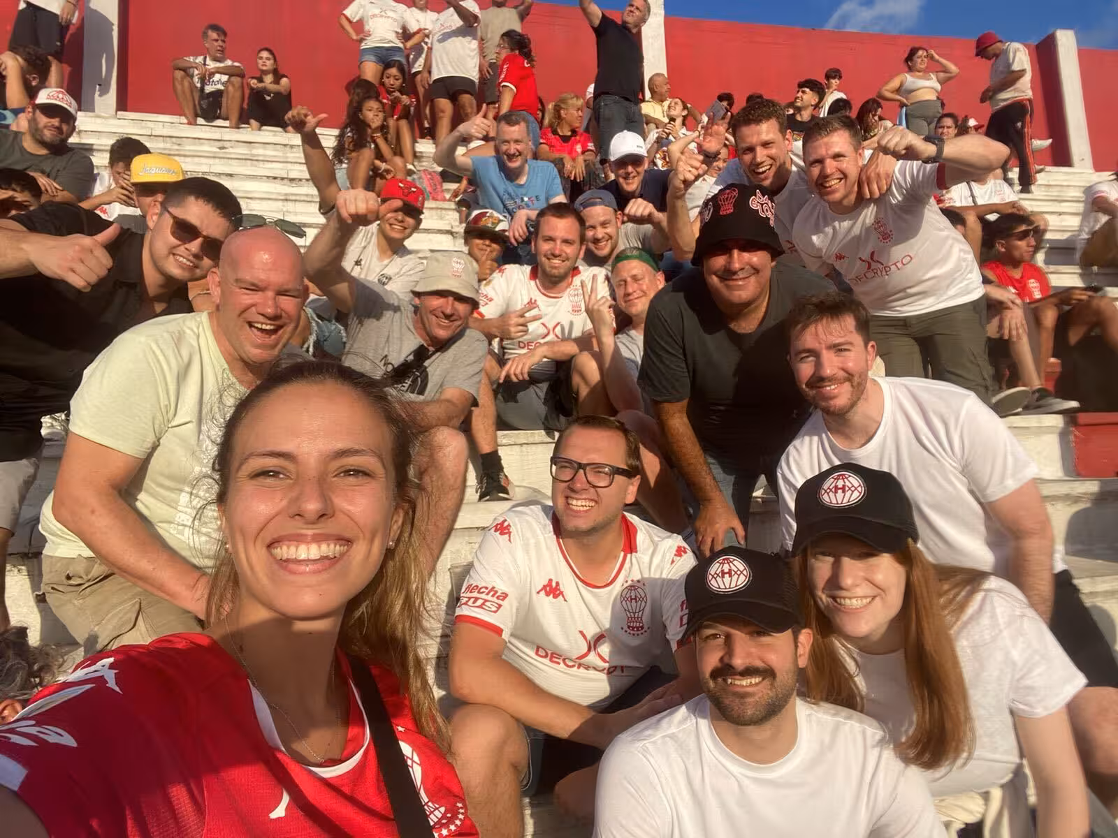 Fans and travelers selfie in stadium stands during Buenos Aires soccer matchday tour with local supporters
