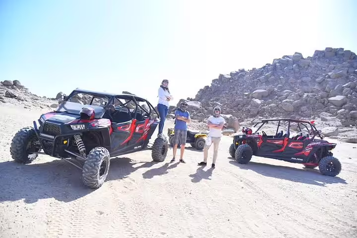 Group photo with double buggies in Sinai Desert near Sharm El Sheikh, ready for off-road safari adventure