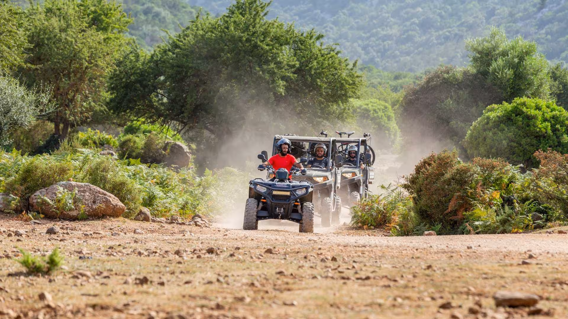 Adventurous buggy tour through lush landscapes near Baunei heading towards Punta Salinas.