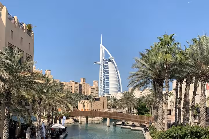 Burj Al Arab view from Madinat Jumeirah canal on private Dubai city tour from Abu Dhabi with fountains show