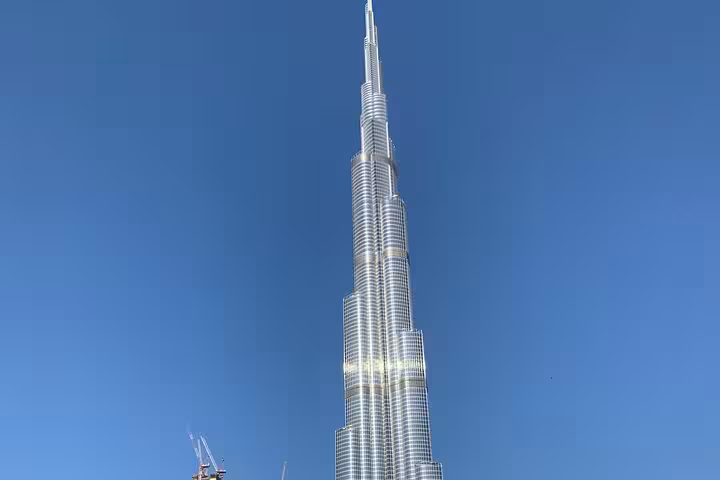 Burj Khalifa soaring over Downtown Dubai skyline, iconic stop on private half-day Dubai city tour