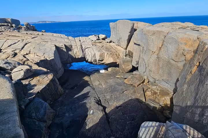 Natural rock formation with ocean views on the 2 Day Tour Busselton Jetty, Ngilgi Cave to Valley of the Giants.