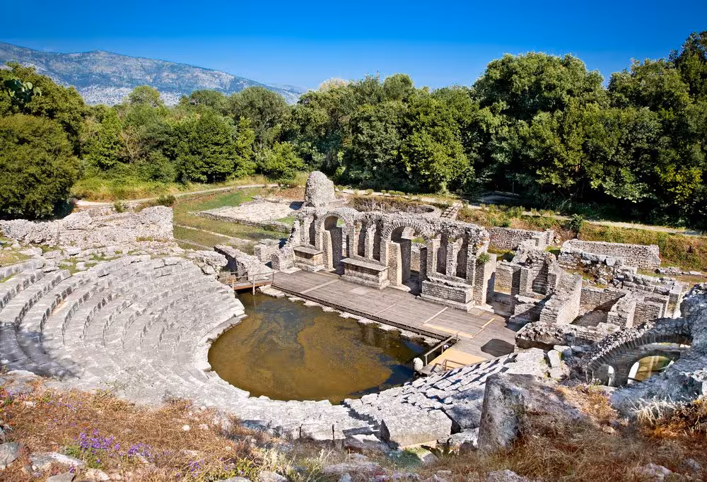 Ancient amphitheater ruins in Butrint National Park, showcasing Albania's rich history and cultural heritage.