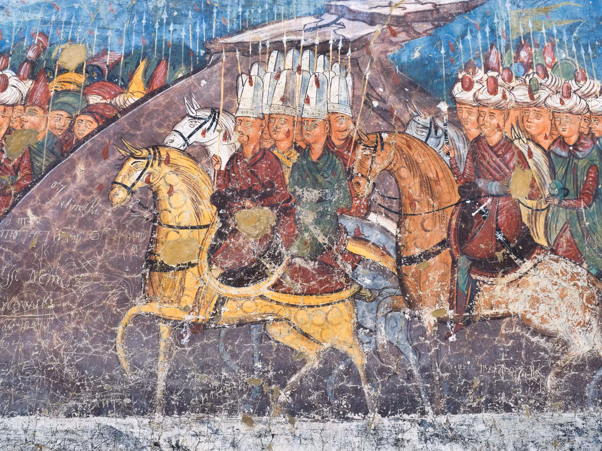 Ancient Byzantine fresco depicting Ottoman cavalry warriors on Bucovina monastery wall during 2-day Romania tour