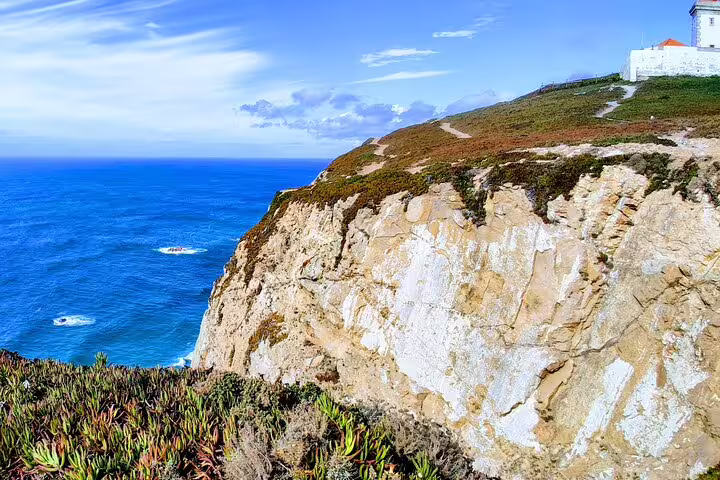 Stunning view of Cabo da Roca's rugged cliffs and Atlantic Ocean on Sintra, Pena Palace, Cascais day trip from Lisbon.