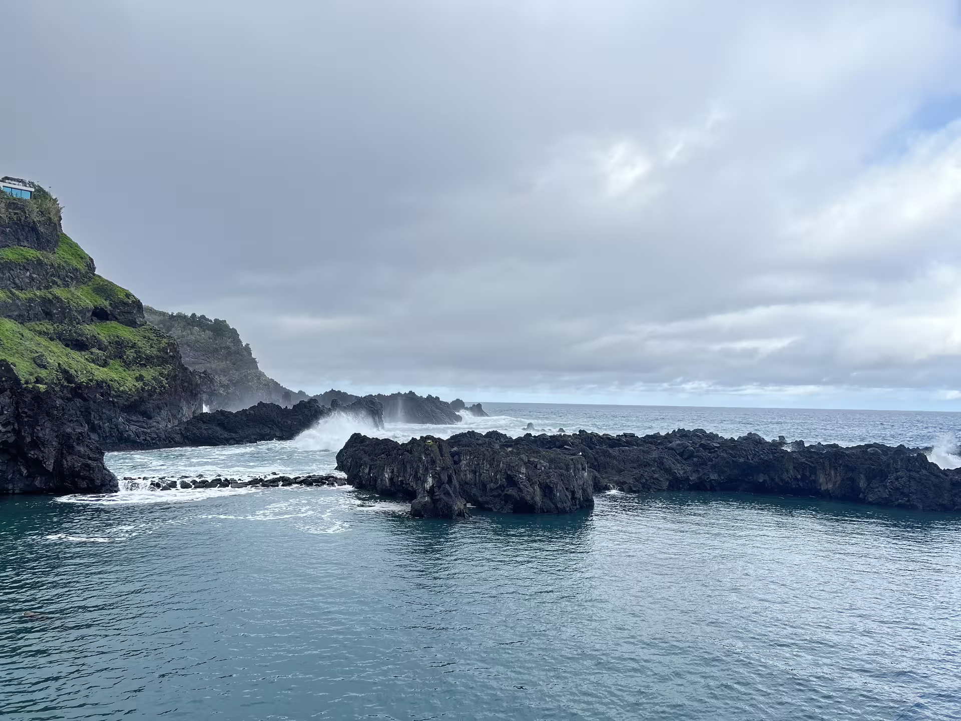 Dramatic coastal cliffs and crashing waves at Cabo Girão on the West side full-day tour, featuring Seixal and Fanal.