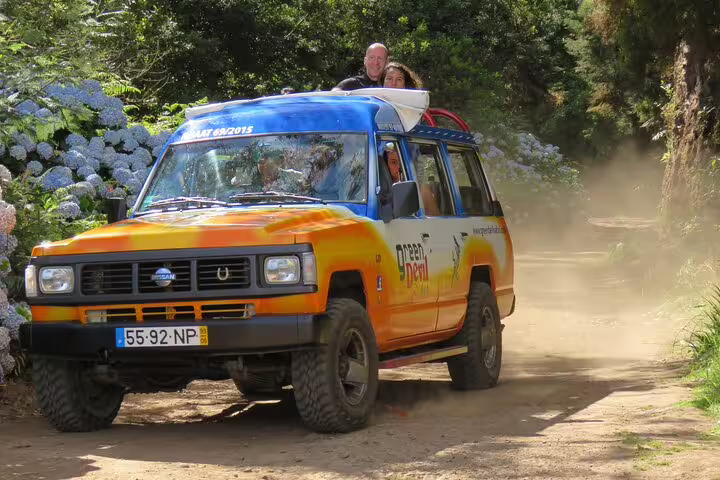Adventurers enjoy a thrilling 4x4 ride through lush landscapes on the Guided Tour Beyond Vineyards Cabo Girão Skywalk Adventure.