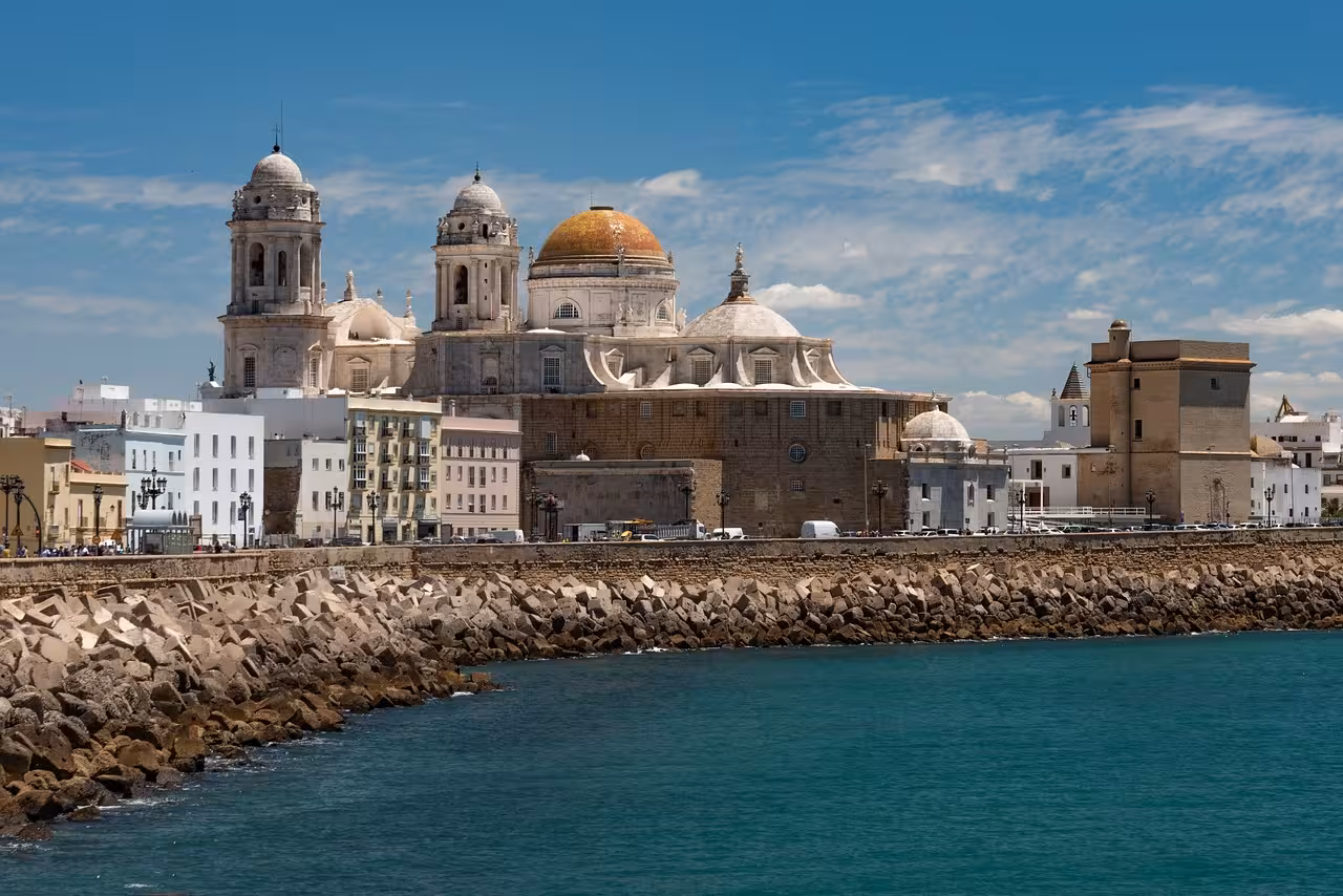 Cadiz Cathedral's stunning architecture along the coastline, blending historical charm with scenic ocean views.