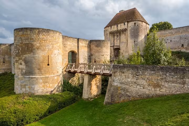 Medieval stone walls and drawbridge entrance of Caen Castle, Normandy, France