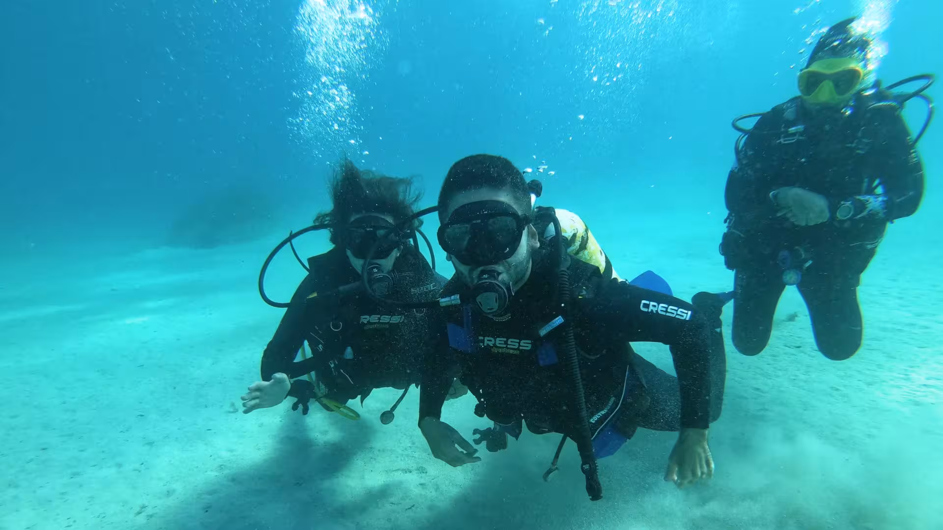 Beginner scuba divers explore the clear waters of Cagliari, enjoying an unforgettable underwater adventure.